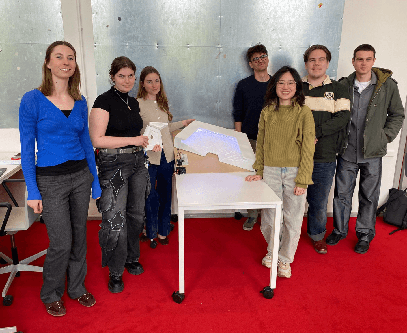 The team with the lit 1:1 Voronoi panel prototype